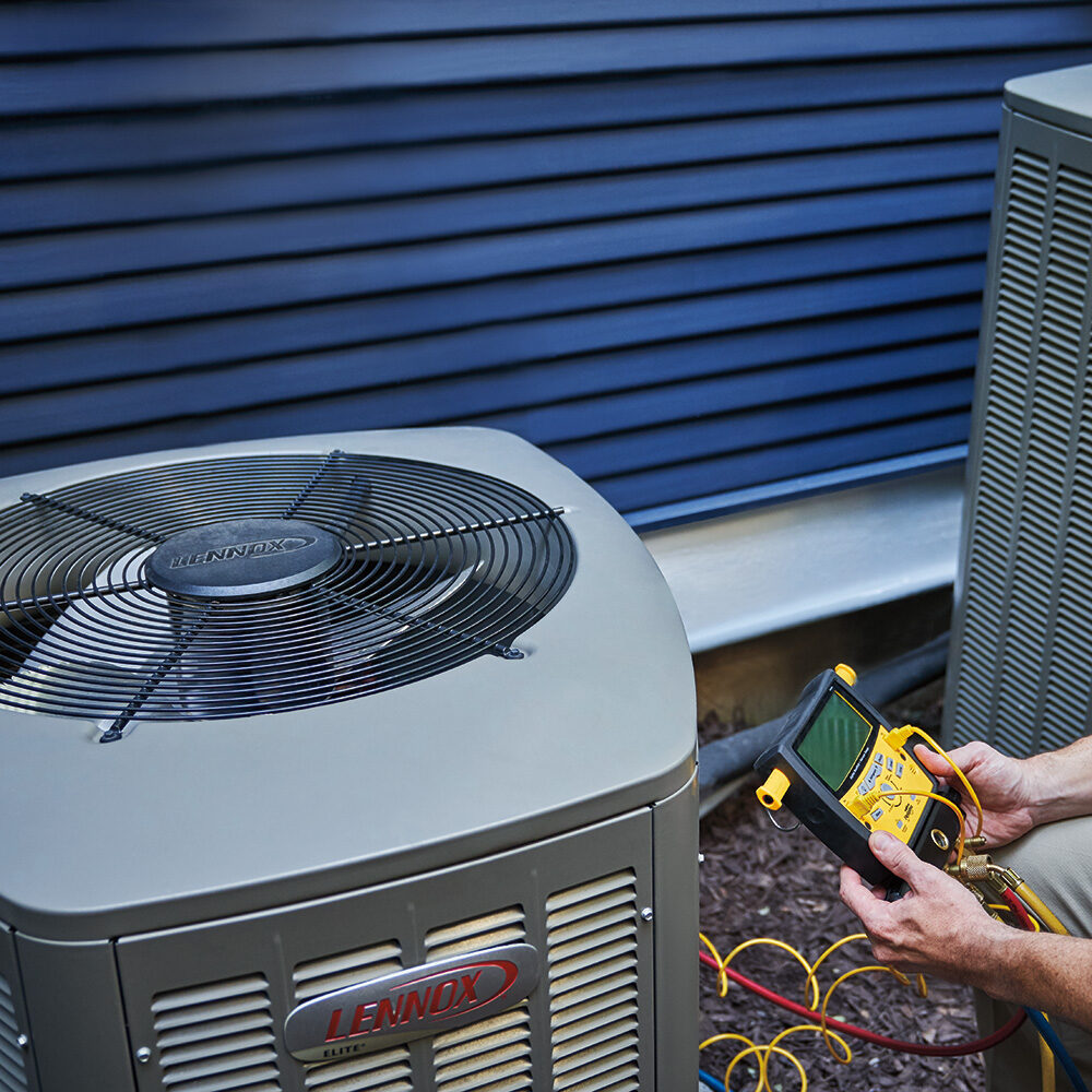 Lennox AC unit being looked at by a technician